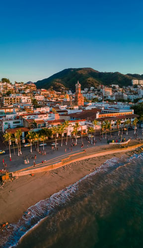 Aerial golden-hour view of Puerto Vallarta malecon and beach