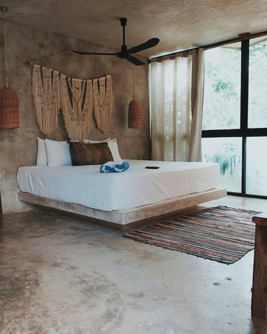 Serene Mexican jungle bedroom with natural light